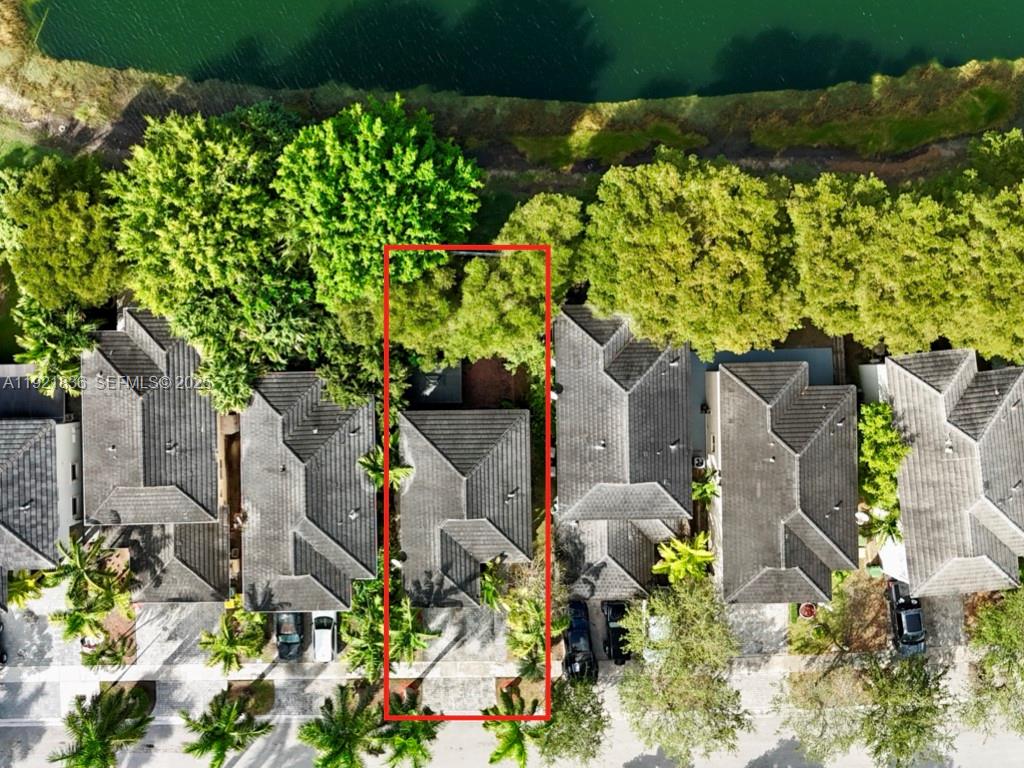 3121 Southeast 2nd Drive Homestead, FL 33033 - Photo 38 of 43 an aerial view of a house with a yard and large trees