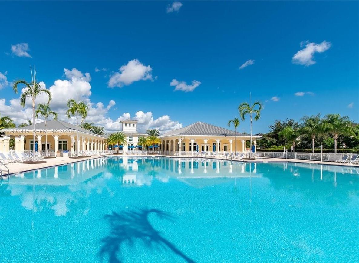 3121 Southeast 2nd Drive Homestead, FL 33033 - Photo 42 of 43 a view of a swimming pool with an outdoor space and seating area
