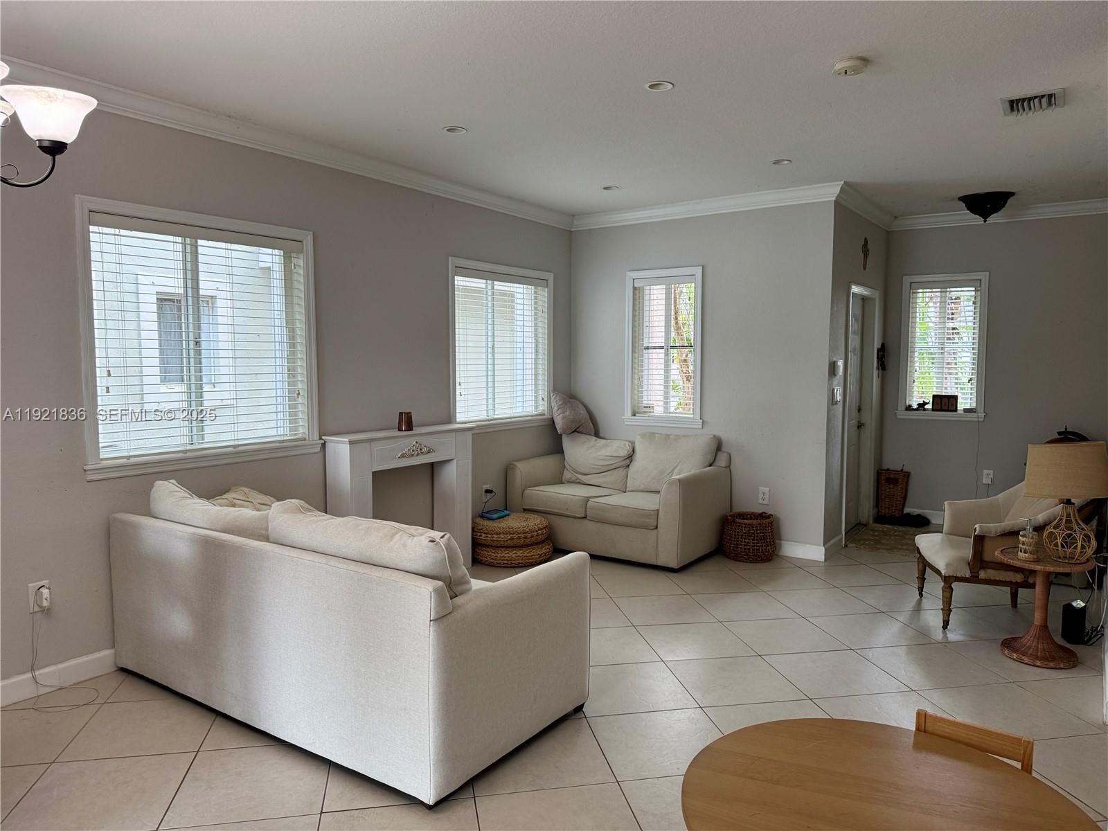 3121 Southeast 2nd Drive Homestead, FL 33033 - Photo 8 of 43 a living room with furniture and a window