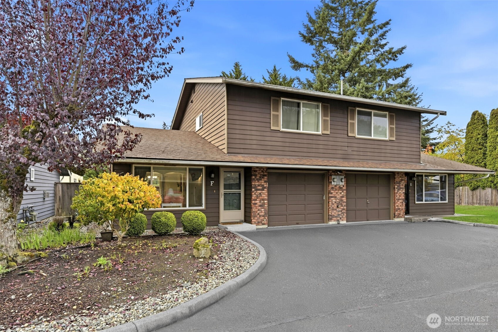 1721 Madison Street, Unit F Everett, WA 98203 - Photo 1 of 36 a front view of a house with garden