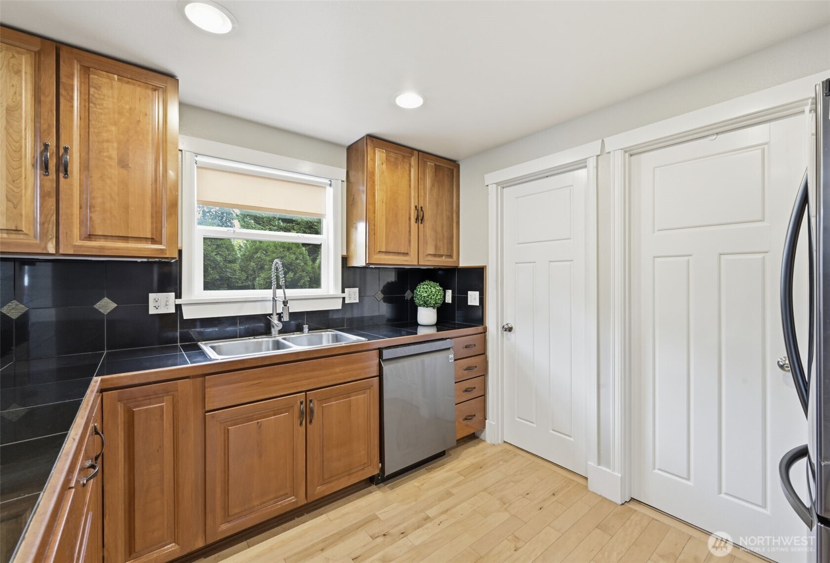 1721 Madison Street, Unit F Everett, WA 98203 - Photo 13 of 36 a kitchen with sink cabinets and window