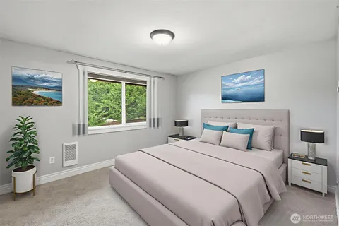 a bedroom with bed and a potted plant