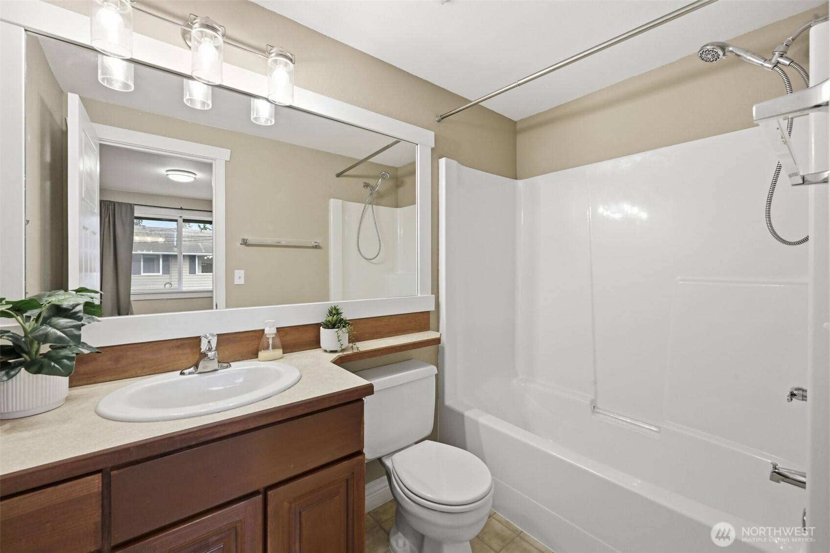 1721 Madison Street, Unit F Everett, WA 98203 - Photo 22 of 36 a bathroom with a granite countertop sink a toilet and shower