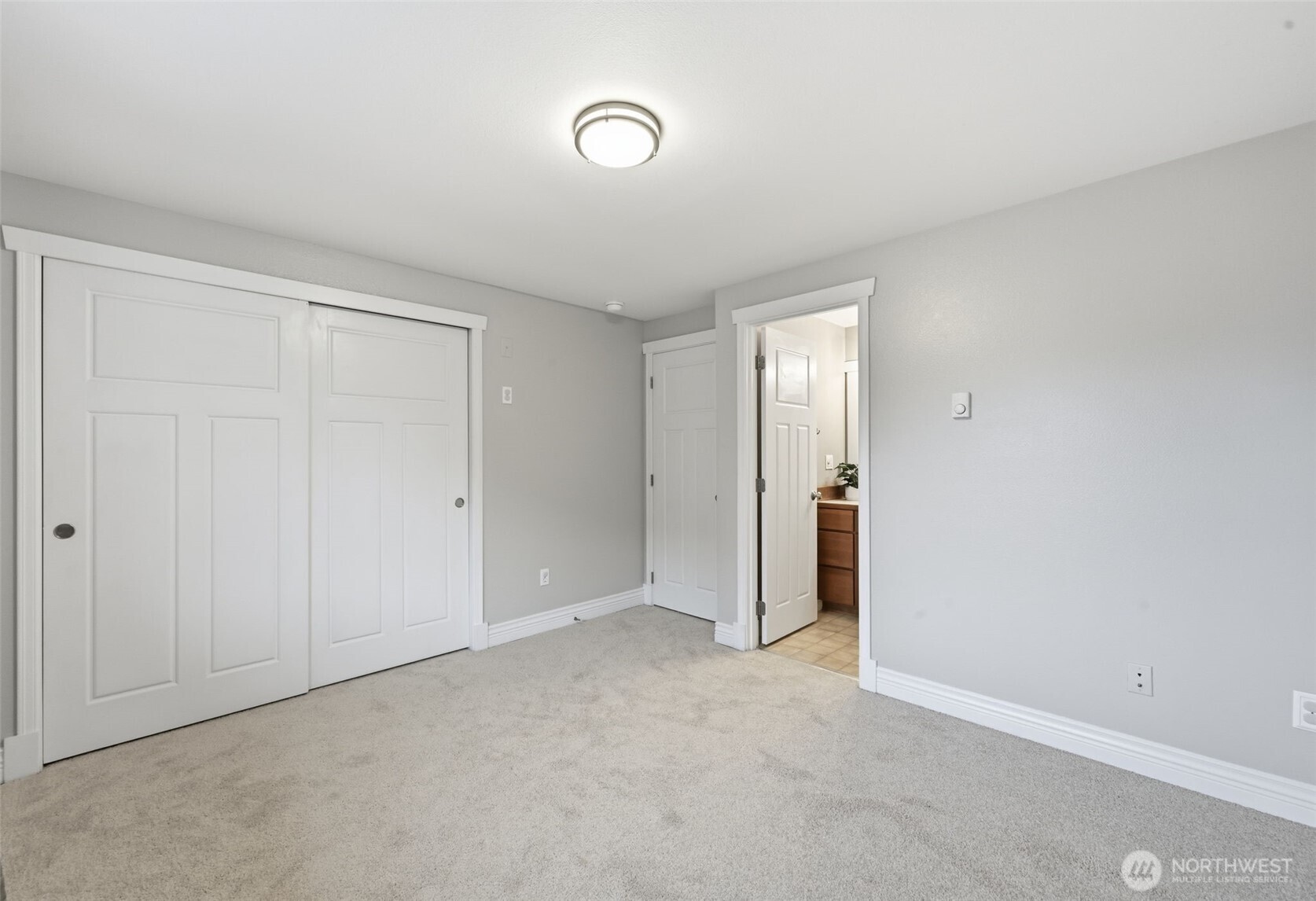 1721 Madison Street, Unit F Everett, WA 98203 - Photo 23 of 36 a view of an empty room and closet area