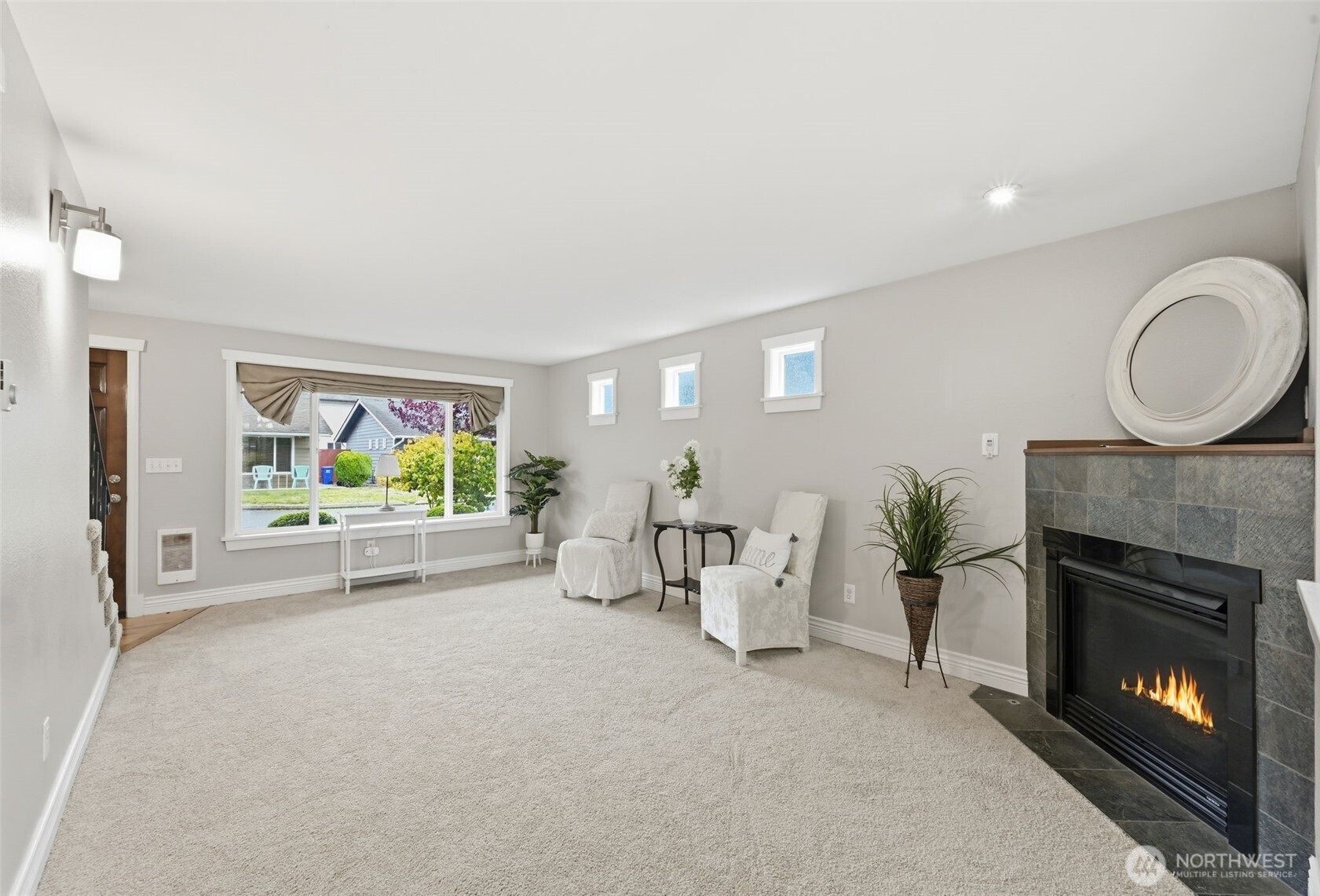 1721 Madison Street, Unit F Everett, WA 98203 - Photo 3 of 36 a living room with furniture a fireplace and a large window