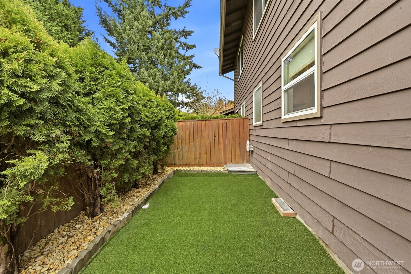 1721 Madison Street, Unit F Everett, WA 98203 - Photo 31 of 36 a view of a backyard with a garden
