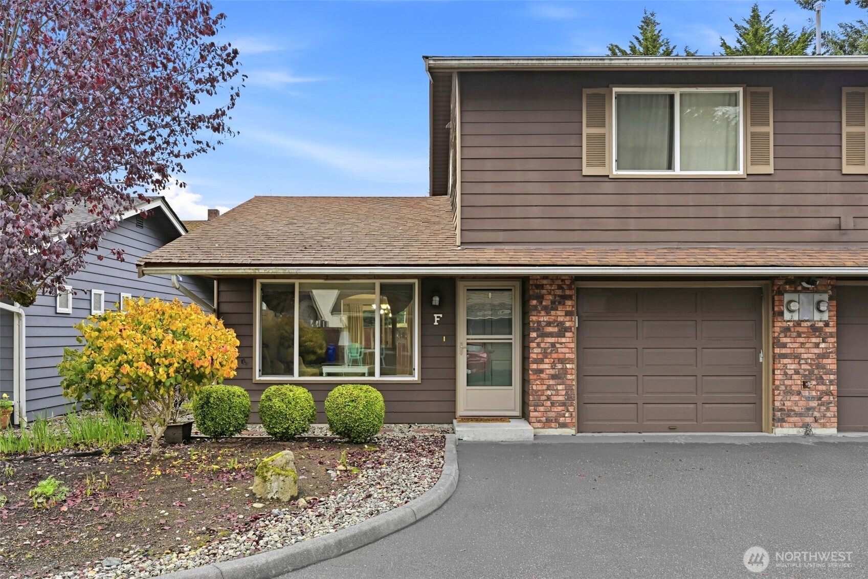 1721 Madison Street, Unit F Everett, WA 98203 - Photo 36 of 36 a front view of a house with garden