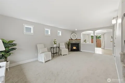 a view of a livingroom with furniture and a fireplace