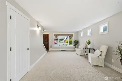 a view of a livingroom with furniture and window