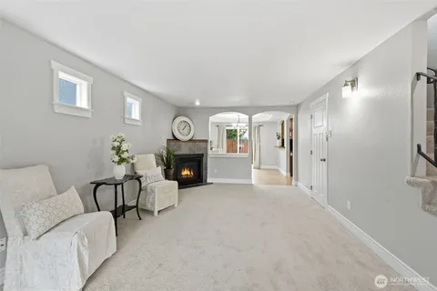 a view of livingroom with furniture and a fireplace