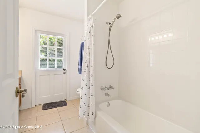 a bathroom with a bath tub and a shower