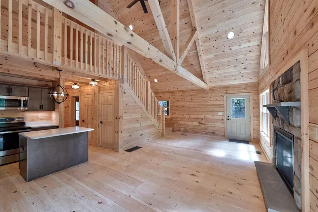 a view of a hallway with seating area