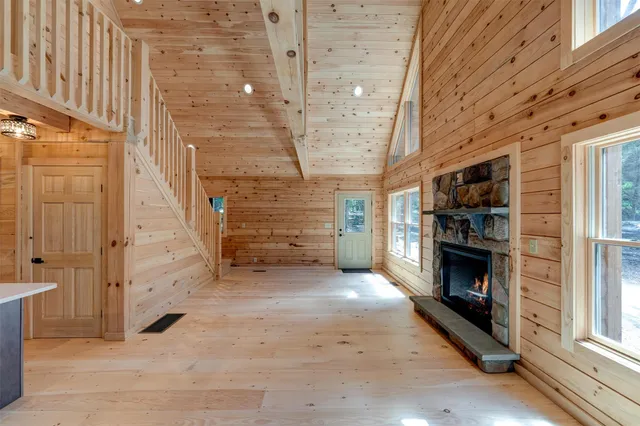 a view of a livingroom with an empty space and a fireplace