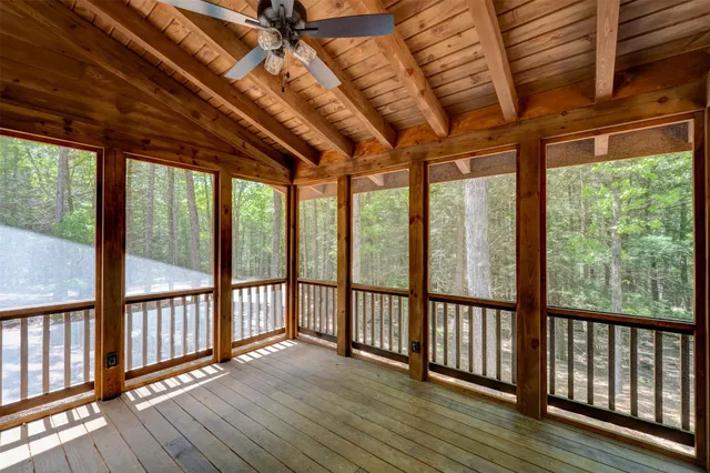 a view of hallway with wooden floor