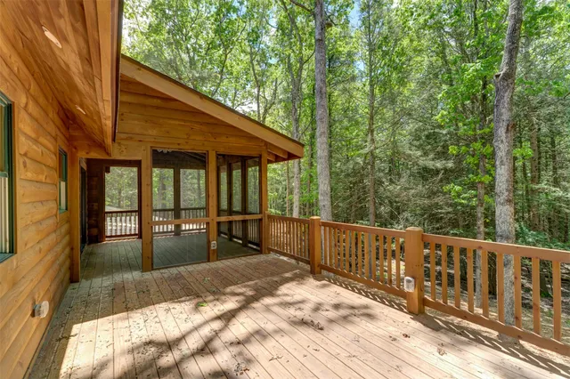 a view of a house with backyard and balcony