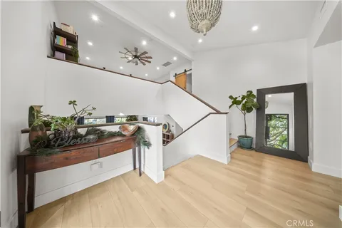 a living room with furniture and a kitchen view