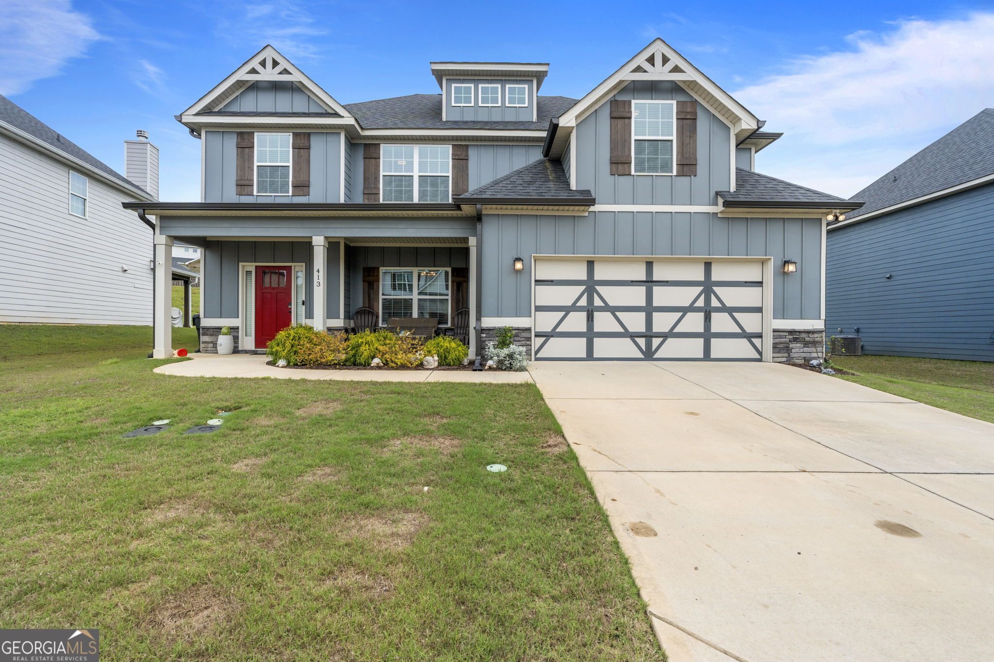 a front view of a house with garden