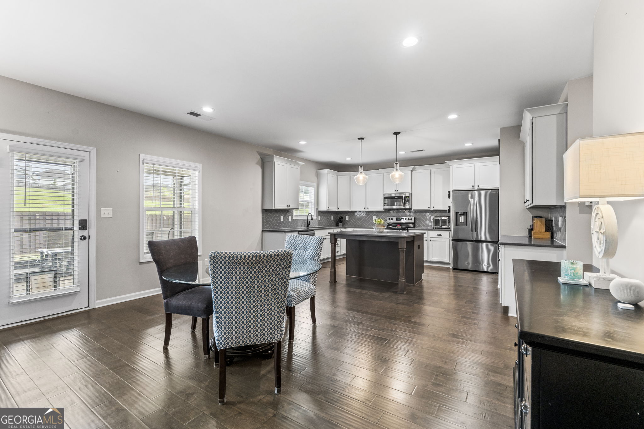 413 Shoshone Circle Kathleen, GA 31047 - Photo 12 of 42 a view of kitchen with dining table and chairs