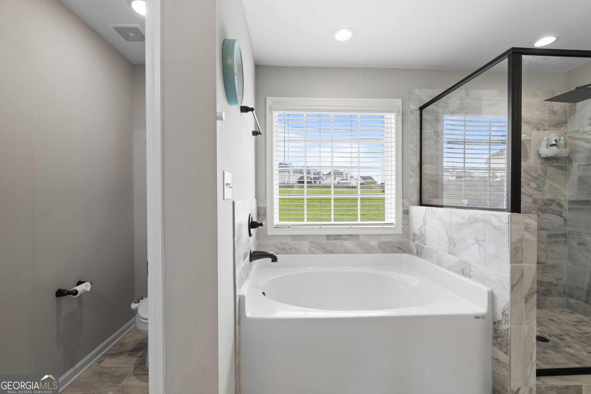 413 Shoshone Circle Kathleen, GA 31047 - Photo 31 of 42 a white bath tub sitting next to a window