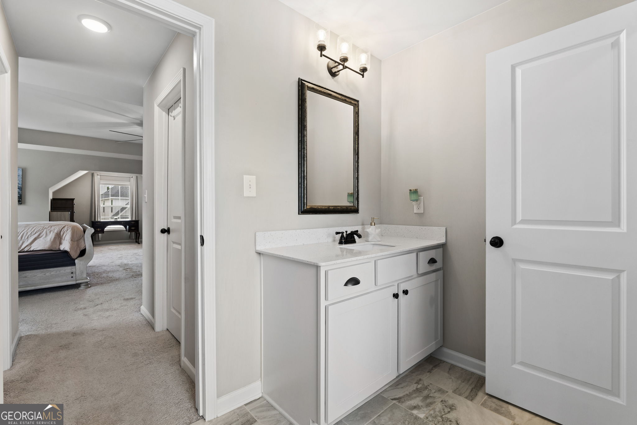 413 Shoshone Circle Kathleen, GA 31047 - Photo 35 of 42 a bathroom with a sink vanity and mirror