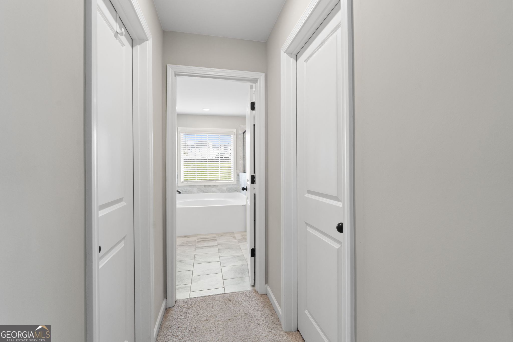 413 Shoshone Circle Kathleen, GA 31047 - Photo 37 of 42 a view of a bathroom from the hallway with toilet