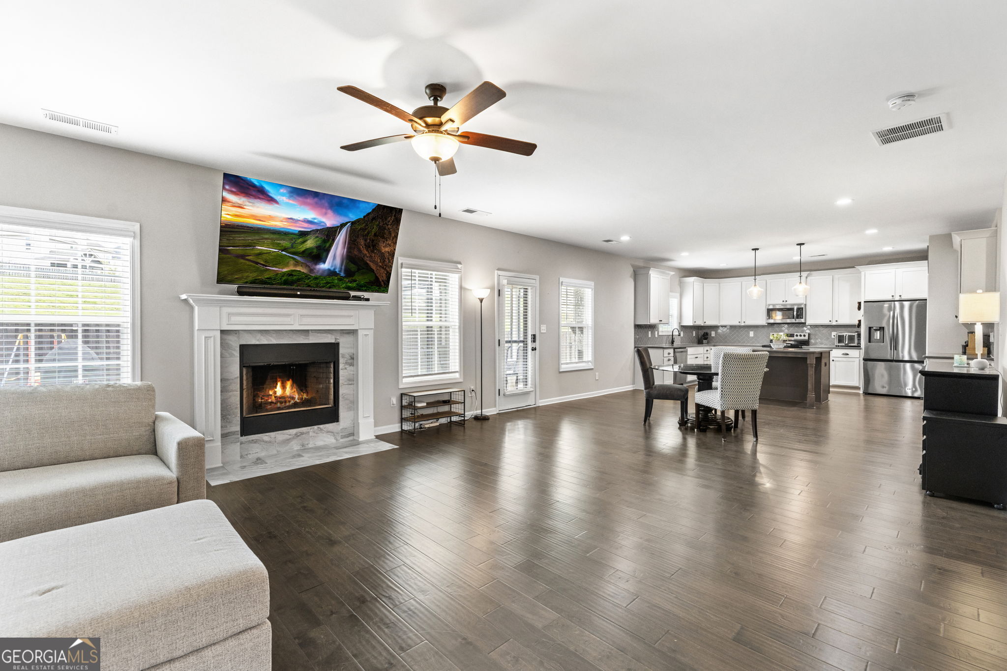 413 Shoshone Circle Kathleen, GA 31047 - Photo 5 of 42 a living room with furniture and a fireplace