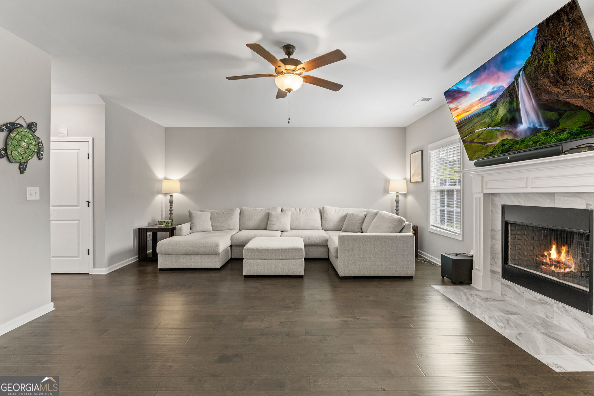 413 Shoshone Circle Kathleen, GA 31047 - Photo 7 of 42 a living room with fireplace furniture and a fireplace