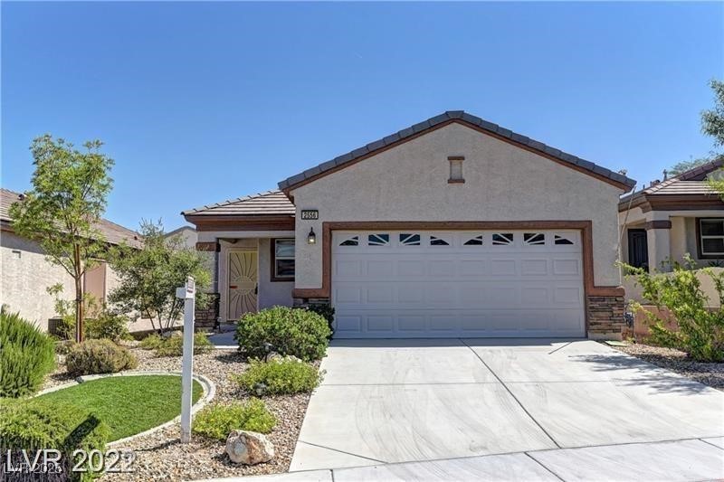 2556 Anani Road Henderson, NV 89044 - Photo 3 of 32 Single story home with stucco siding, concrete driveway, a garage, and a tile roof