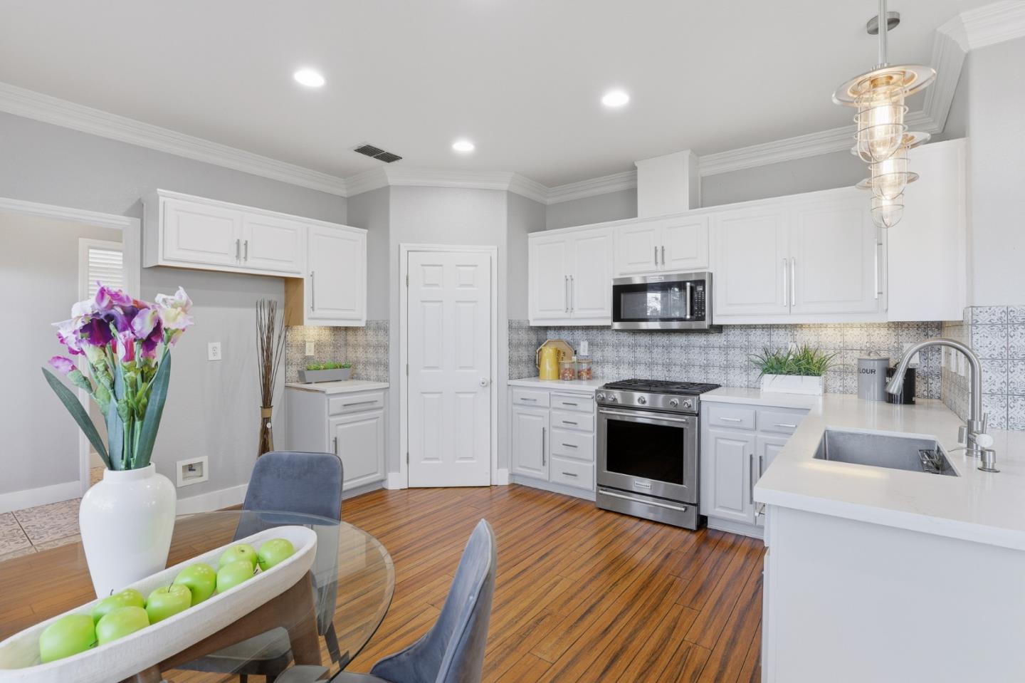 609 Rockspray Circle Pittsburg, CA 94565 - Photo 15 of 43 a kitchen with furniture wooden floor and stainless steel appliances