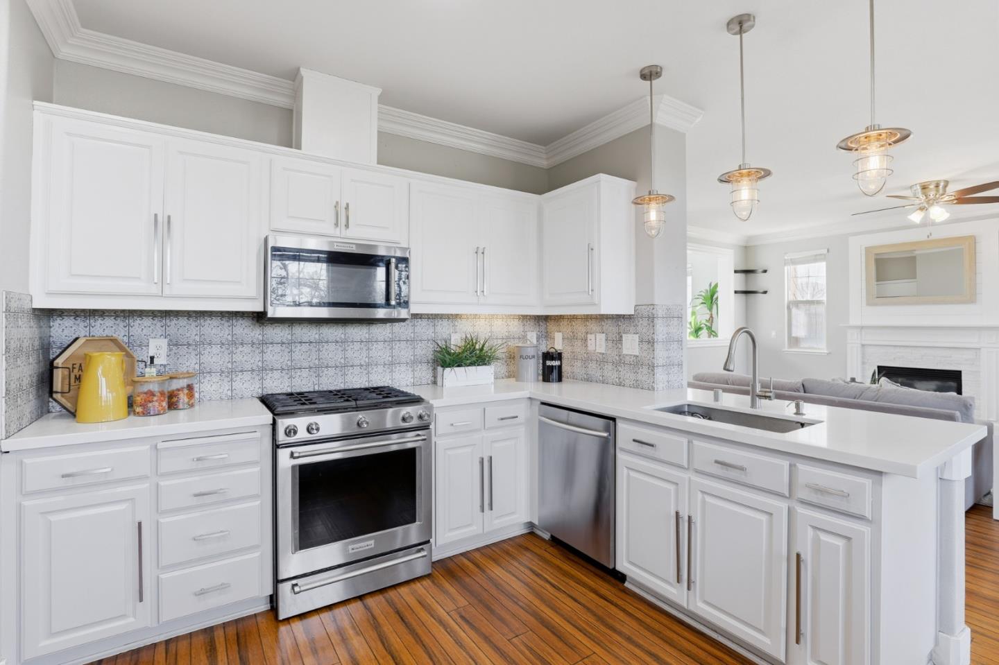 609 Rockspray Circle Pittsburg, CA 94565 - Photo 20 of 43 a kitchen with granite countertop a sink stainless steel appliances and white cabinets