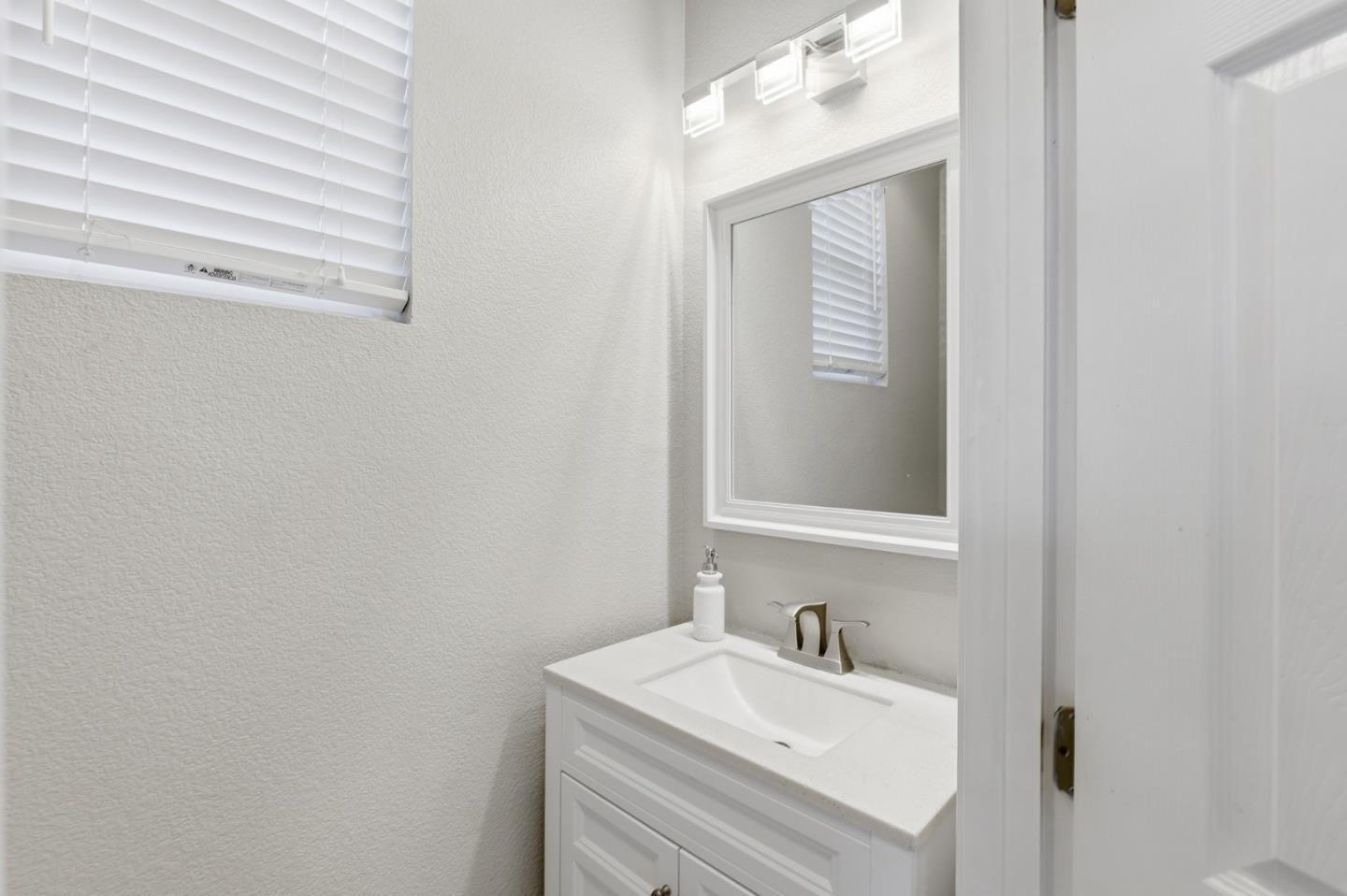 609 Rockspray Circle Pittsburg, CA 94565 - Photo 21 of 43 a bathroom with a sink and a mirror
