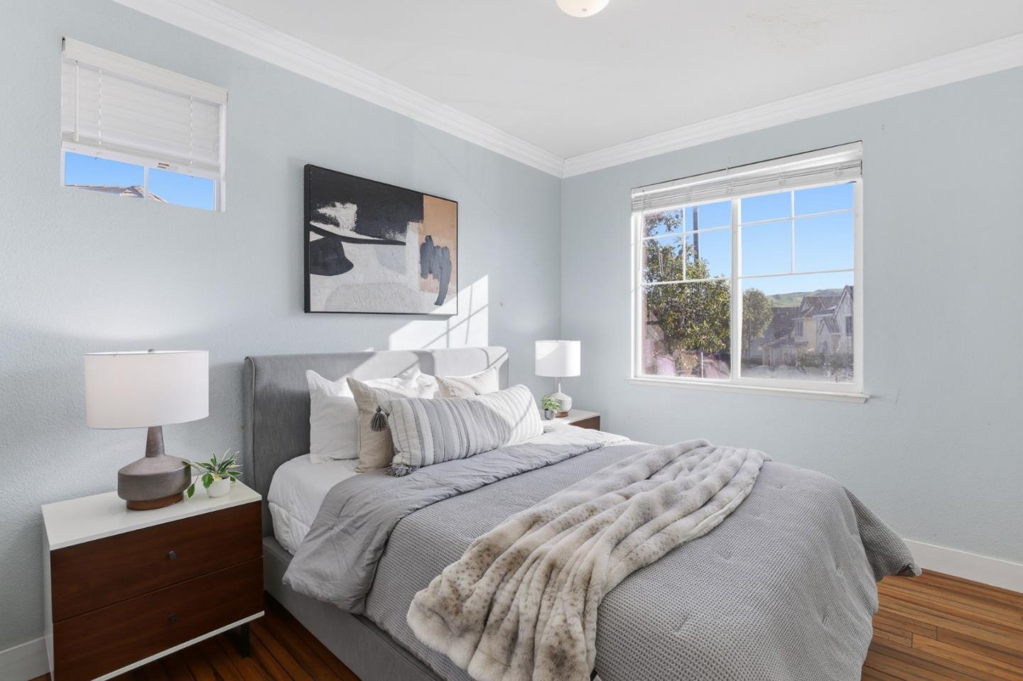 609 Rockspray Circle Pittsburg, CA 94565 - Photo 40 of 43 a bedroom with a bed and a lamp on table