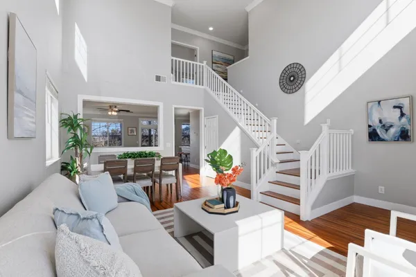 a living room with furniture and a clock