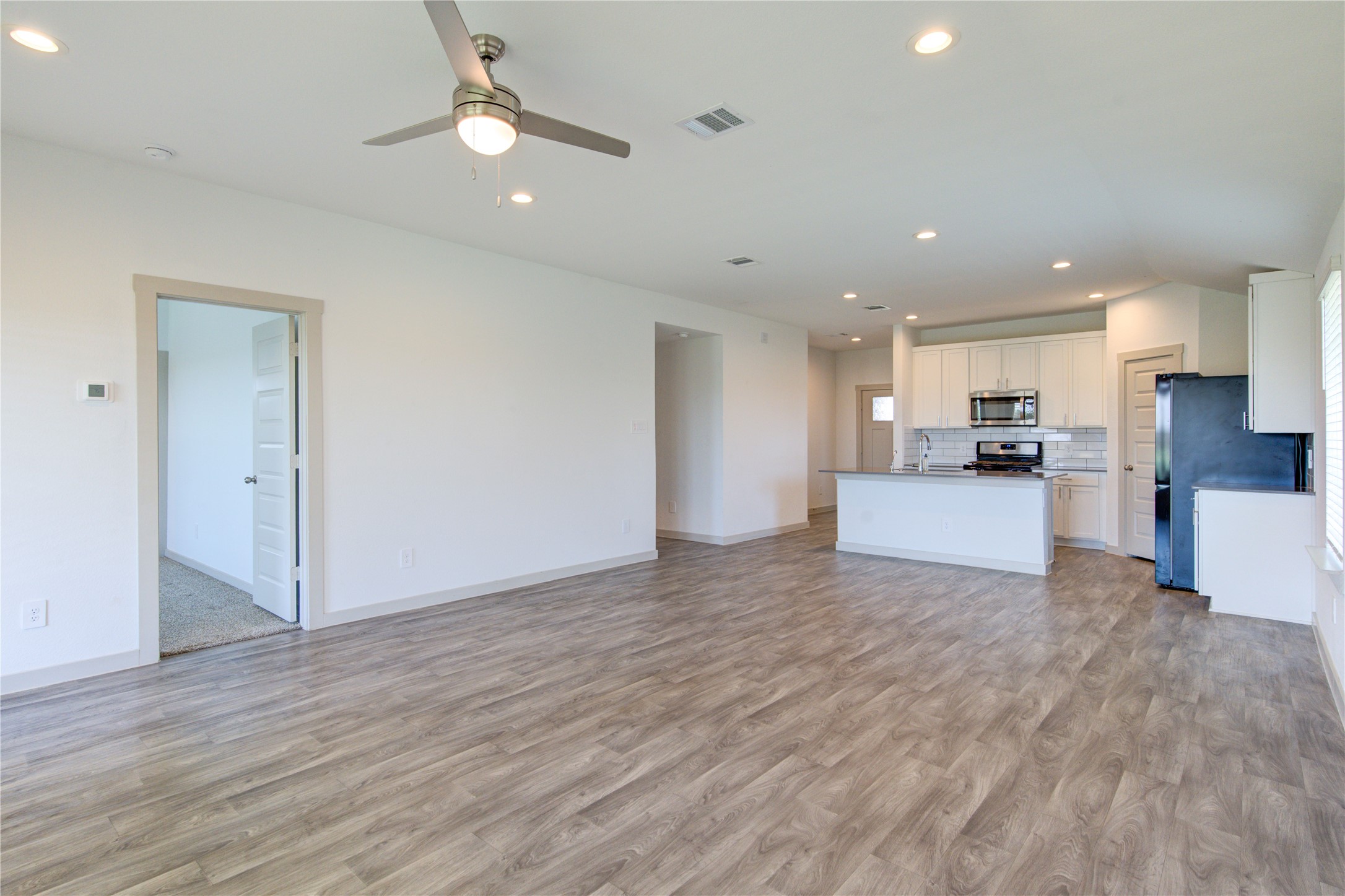41 Desert Spring Lane Manvel, TX 77578 - Photo 12 of 33 a view of kitchen with wooden floor and window