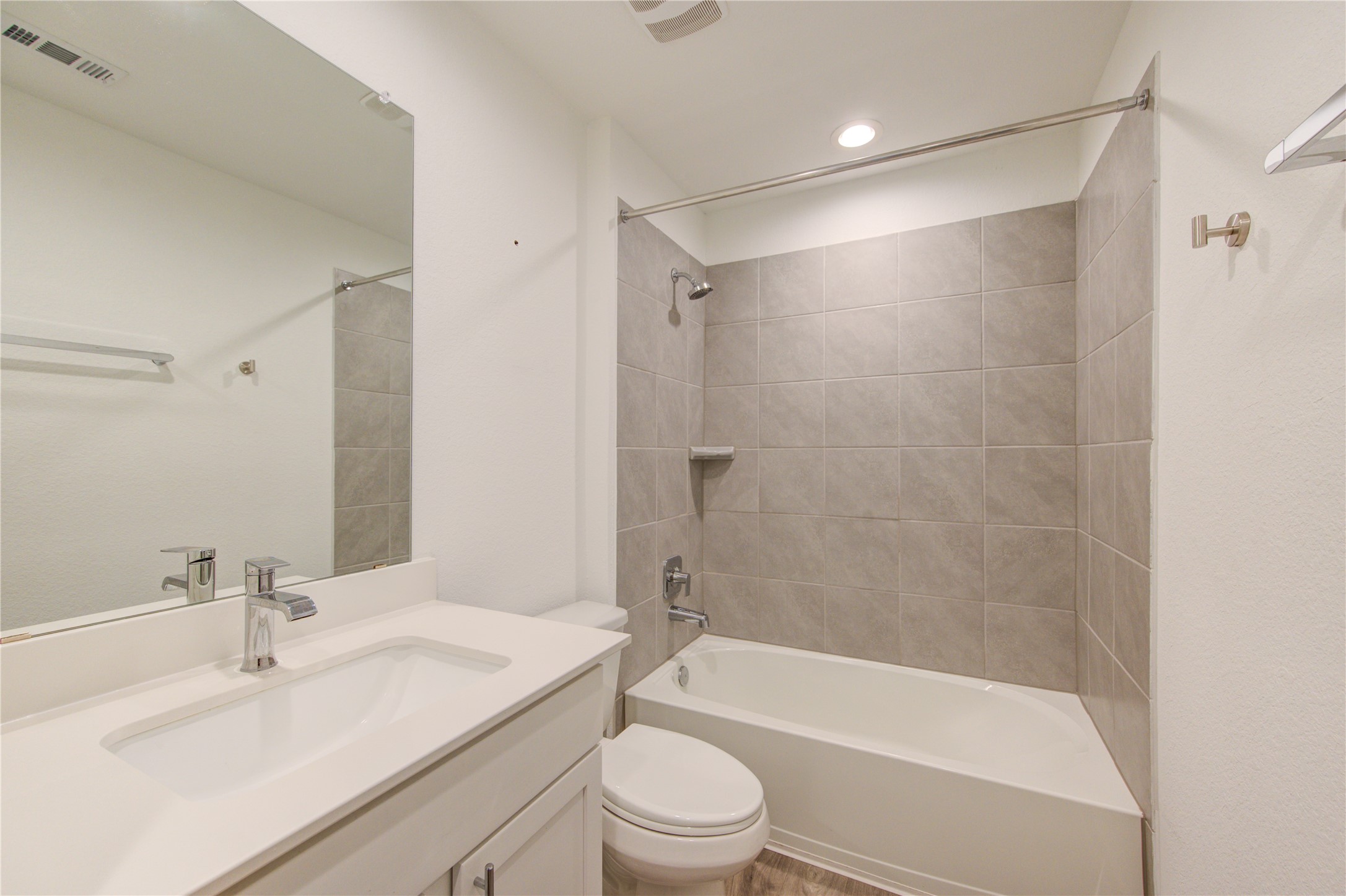 41 Desert Spring Lane Manvel, TX 77578 - Photo 25 of 33 a bathroom with a bathtub shower sink vanity mirror and toilet