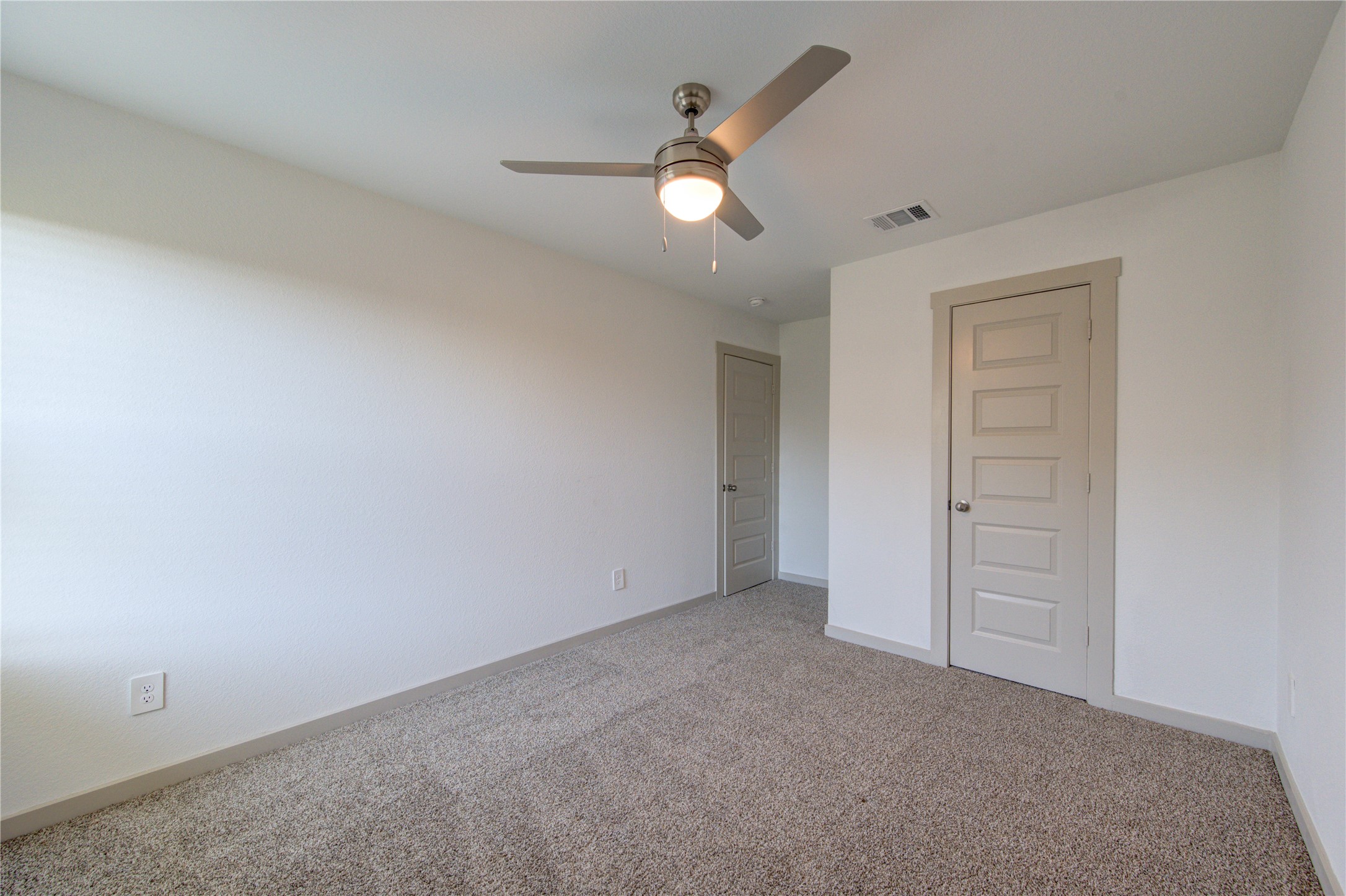 41 Desert Spring Lane Manvel, TX 77578 - Photo 28 of 33 an empty room with closet and a ceiling fan