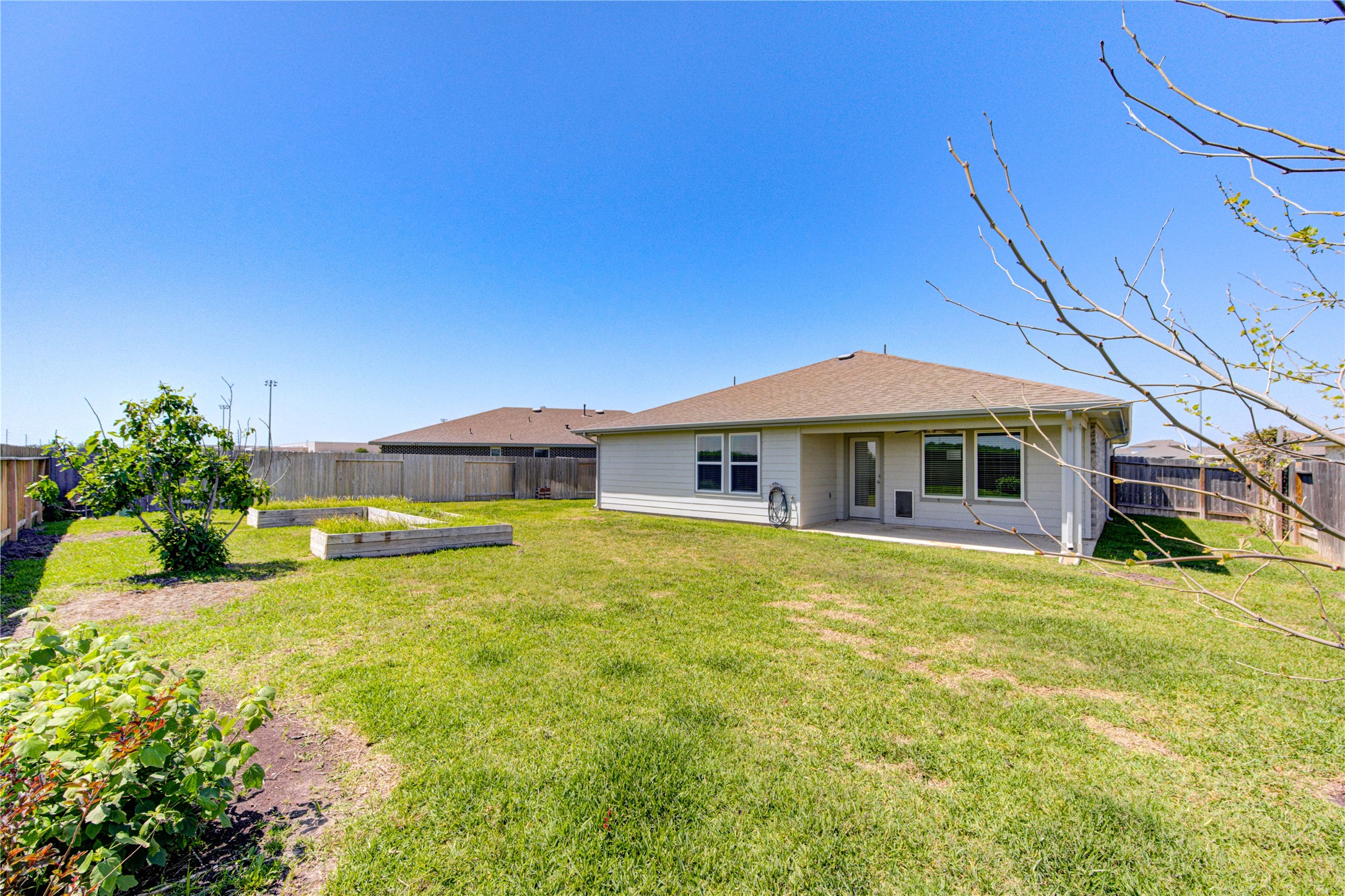 41 Desert Spring Lane Manvel, TX 77578 - Photo 32 of 33 a yellow house with trees in front of it