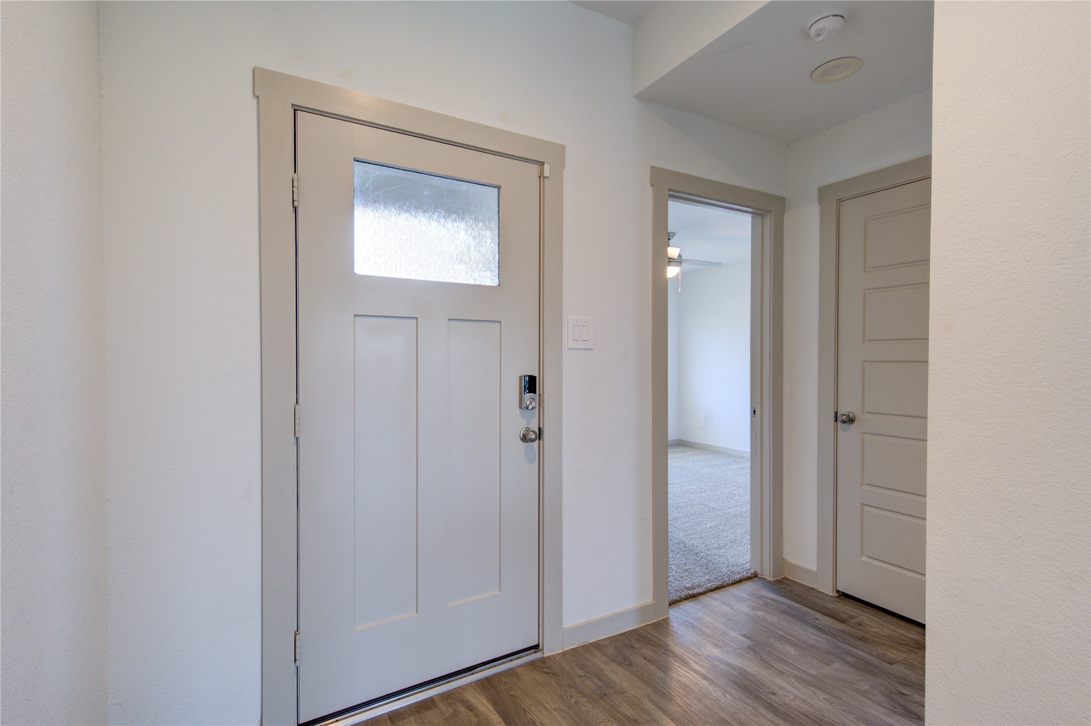 41 Desert Spring Lane Manvel, TX 77578 - Photo 5 of 33 a view of a hallway with wooden floor