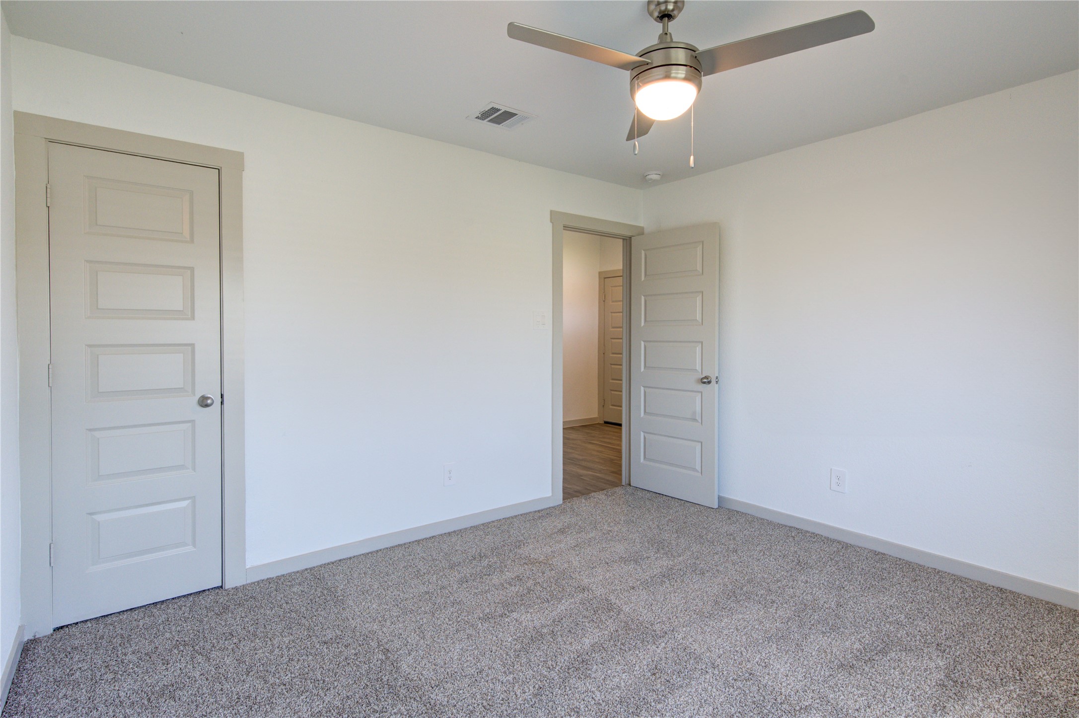 41 Desert Spring Lane Manvel, TX 77578 - Photo 7 of 33 an empty room with closet and a chandelier fan