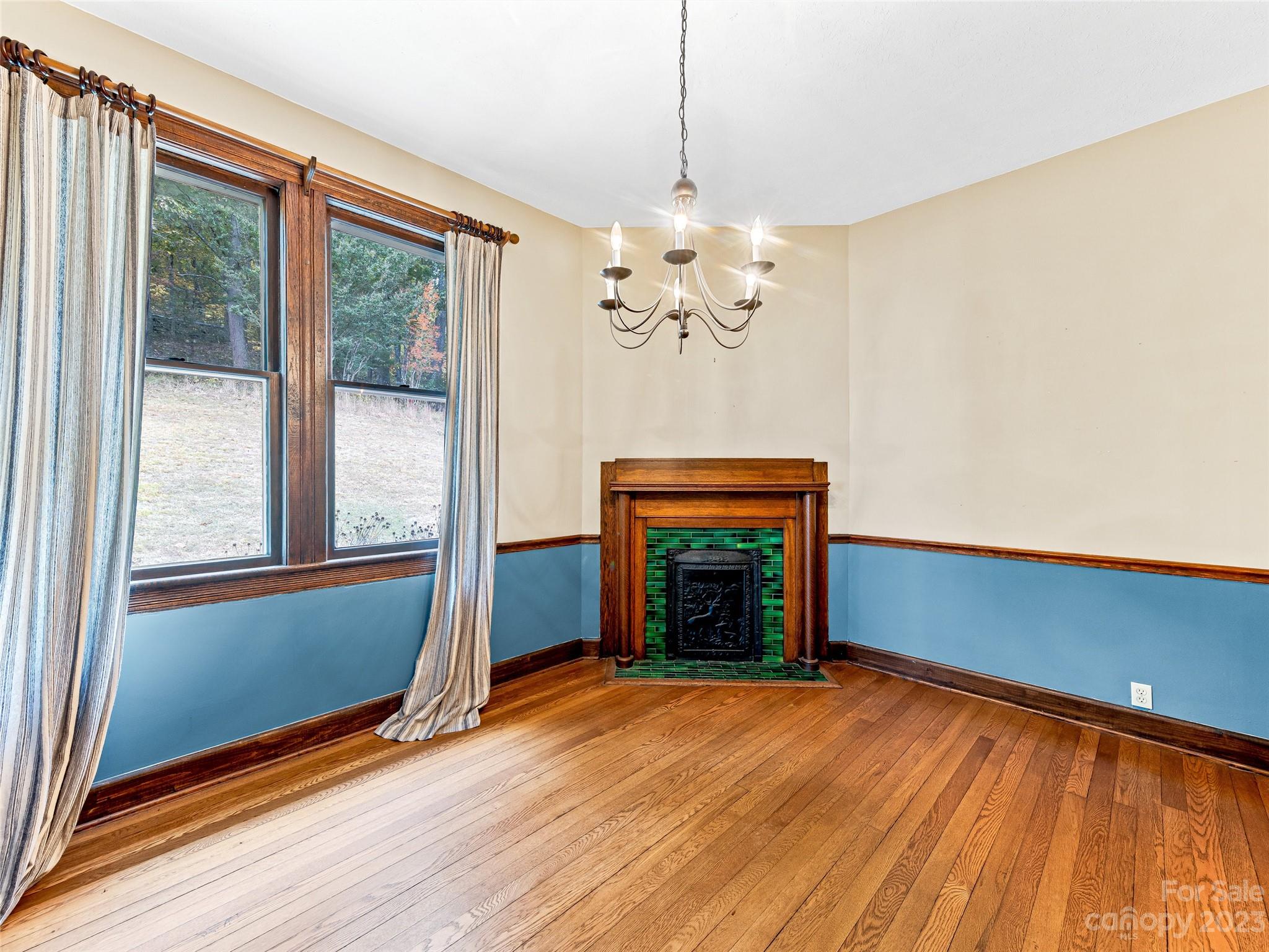 1200 Redmon Road Marshall, NC 28753 - Photo 15 of 37 a view of an empty room with wooden floor and a window