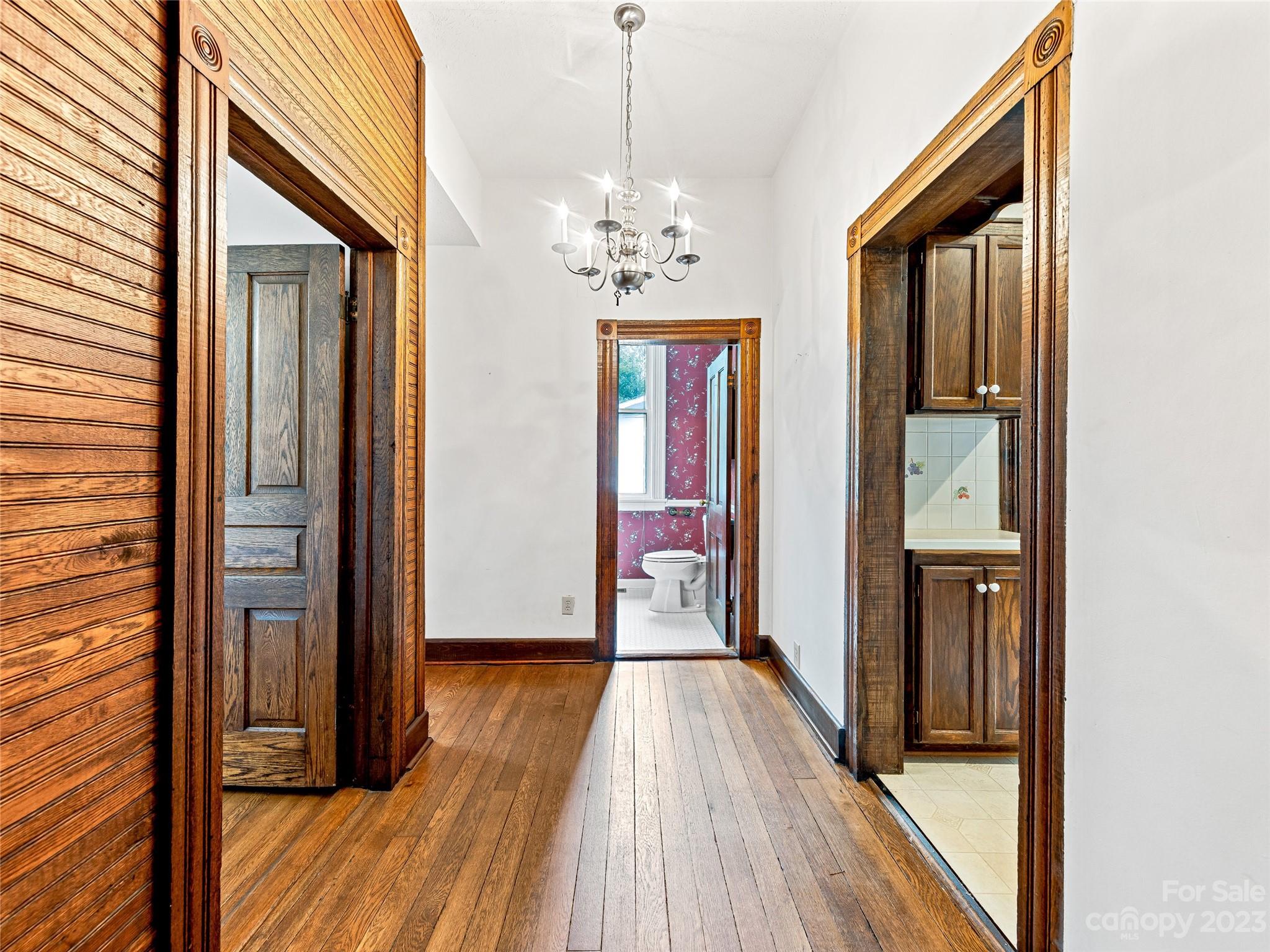1200 Redmon Road Marshall, NC 28753 - Photo 16 of 37 a view of a hallway with wooden floor and staircase