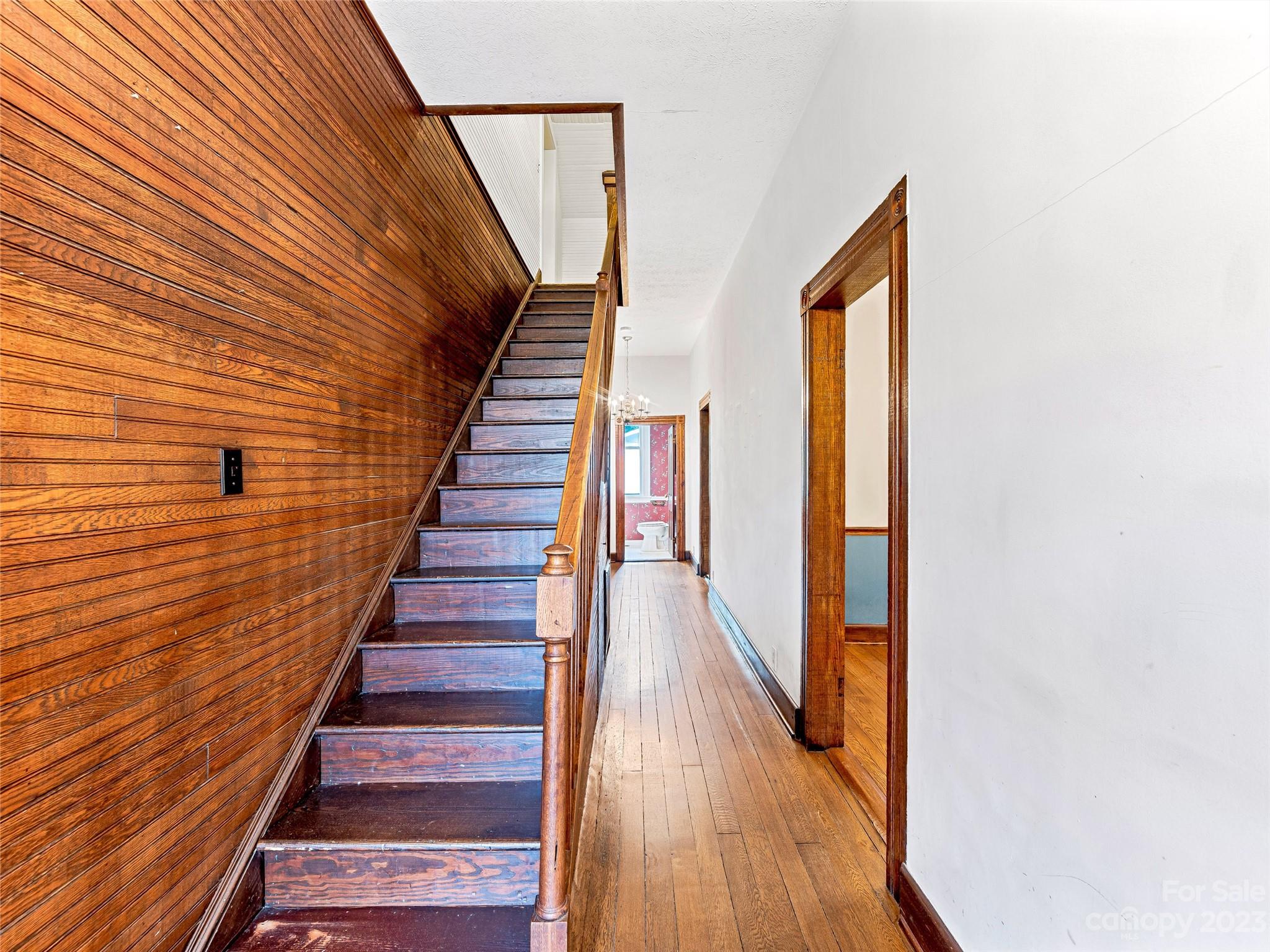 1200 Redmon Road Marshall, NC 28753 - Photo 22 of 37 a view of a hallway with wooden floor and staircase