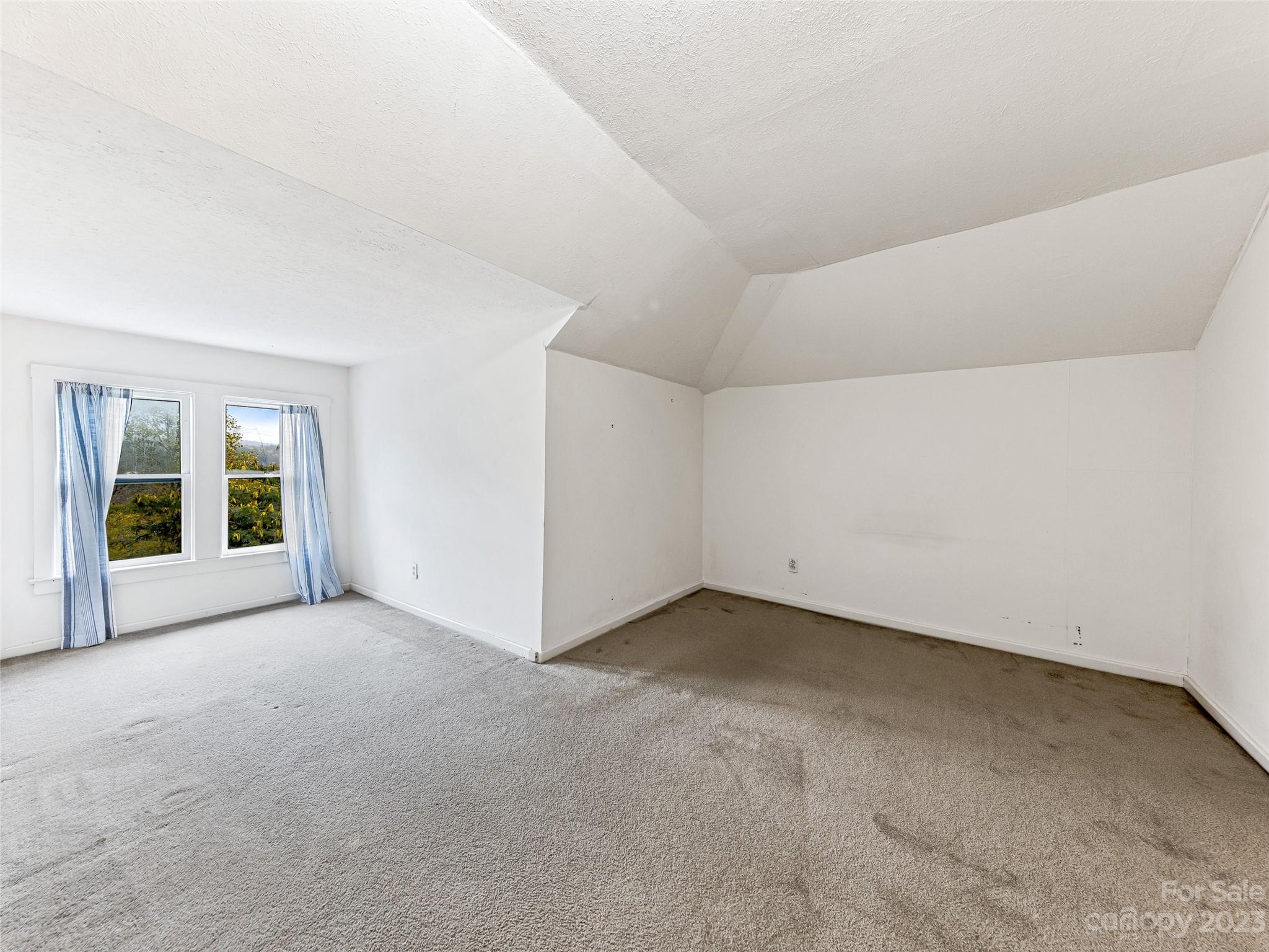 1200 Redmon Road Marshall, NC 28753 - Photo 25 of 37 a view of an empty room with a window