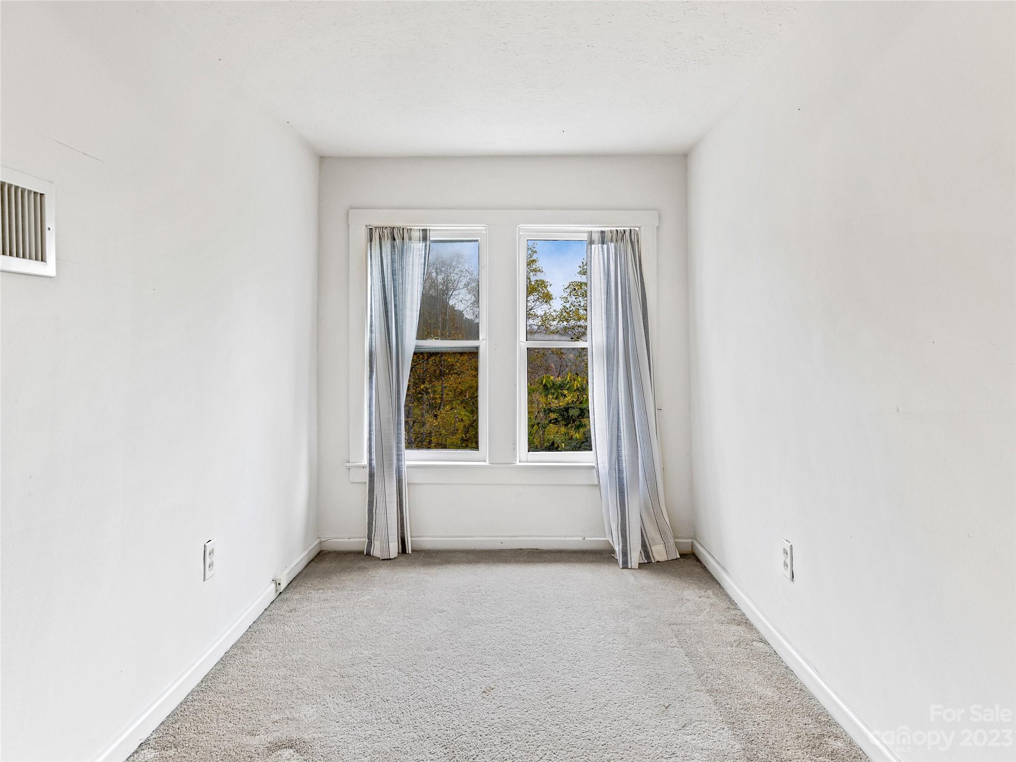 1200 Redmon Road Marshall, NC 28753 - Photo 26 of 37 an empty room with windows