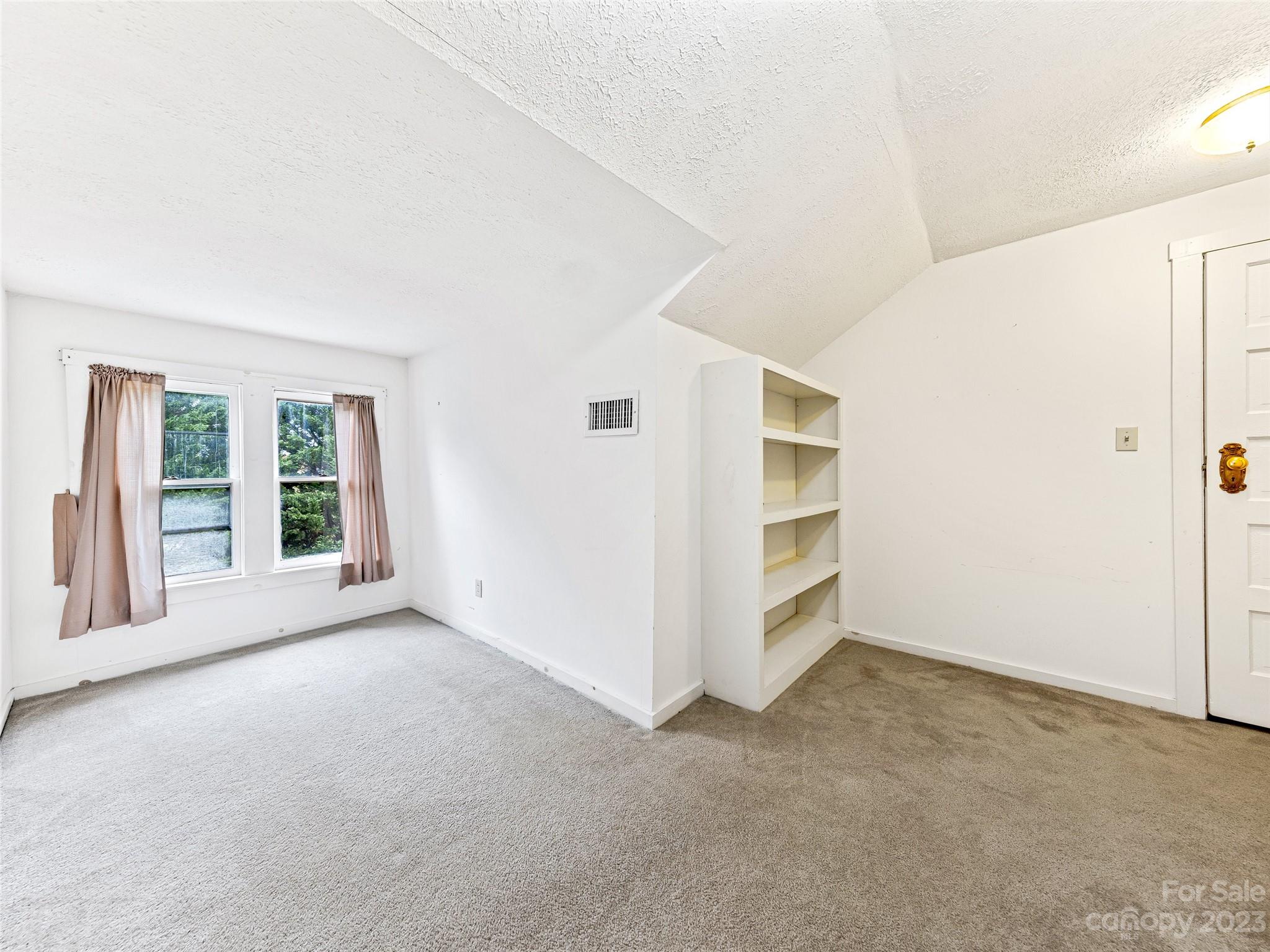 1200 Redmon Road Marshall, NC 28753 - Photo 27 of 37 an empty room with windows