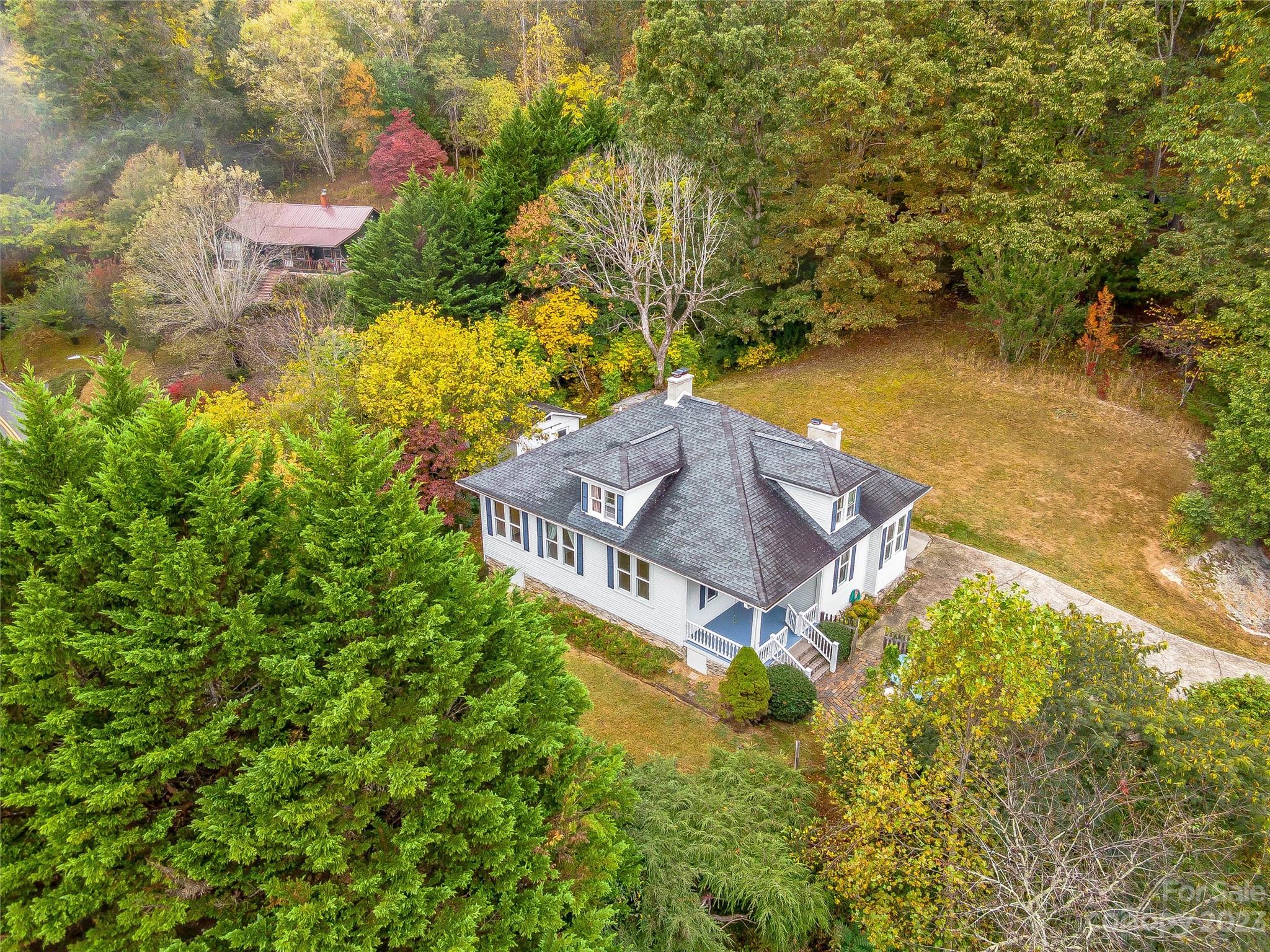 1200 Redmon Road Marshall, NC 28753 - Photo 34 of 37 a view of a house with a yard
