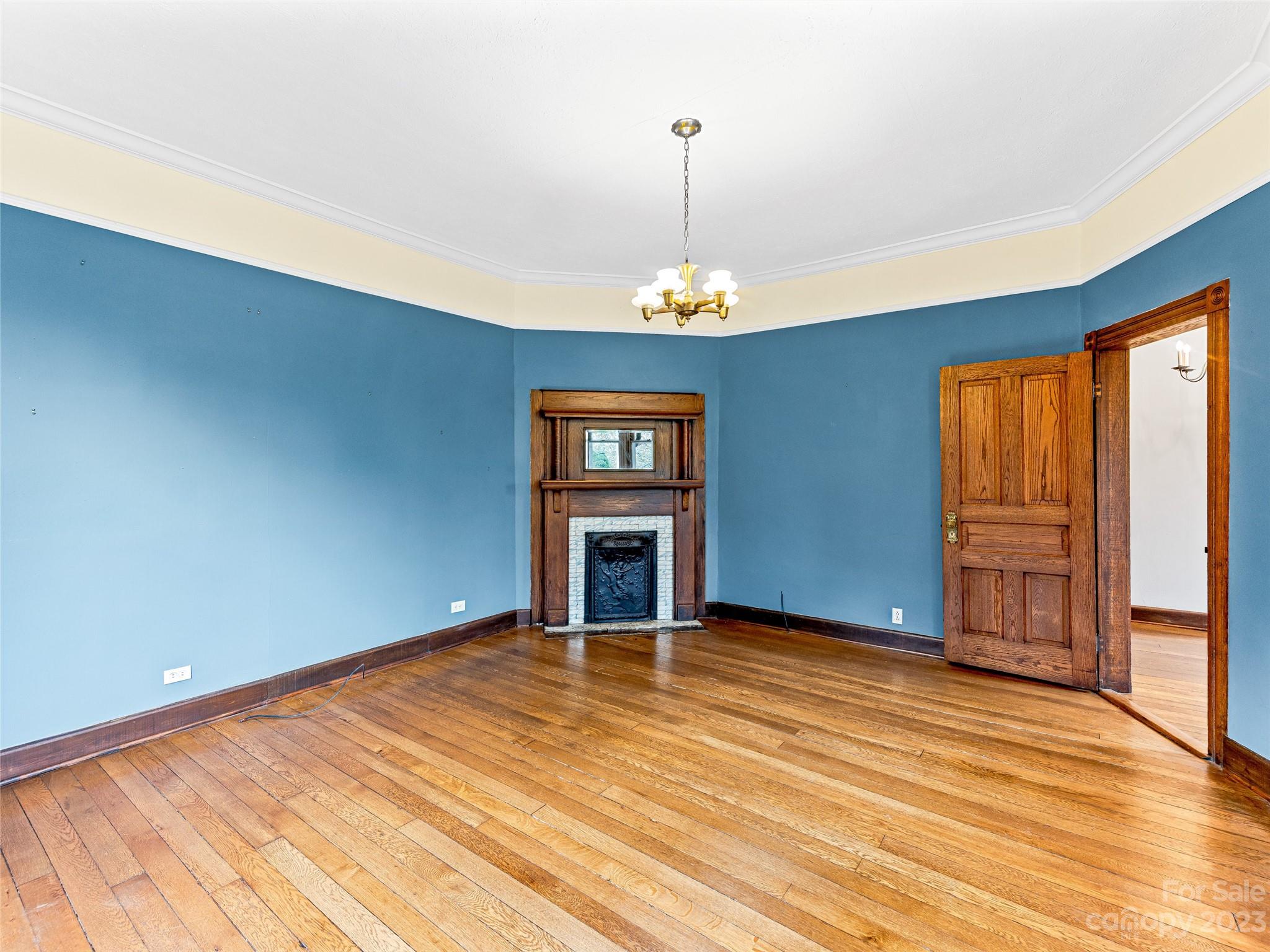 1200 Redmon Road Marshall, NC 28753 - Photo 9 of 37 a view of an empty room with a window and chandelier