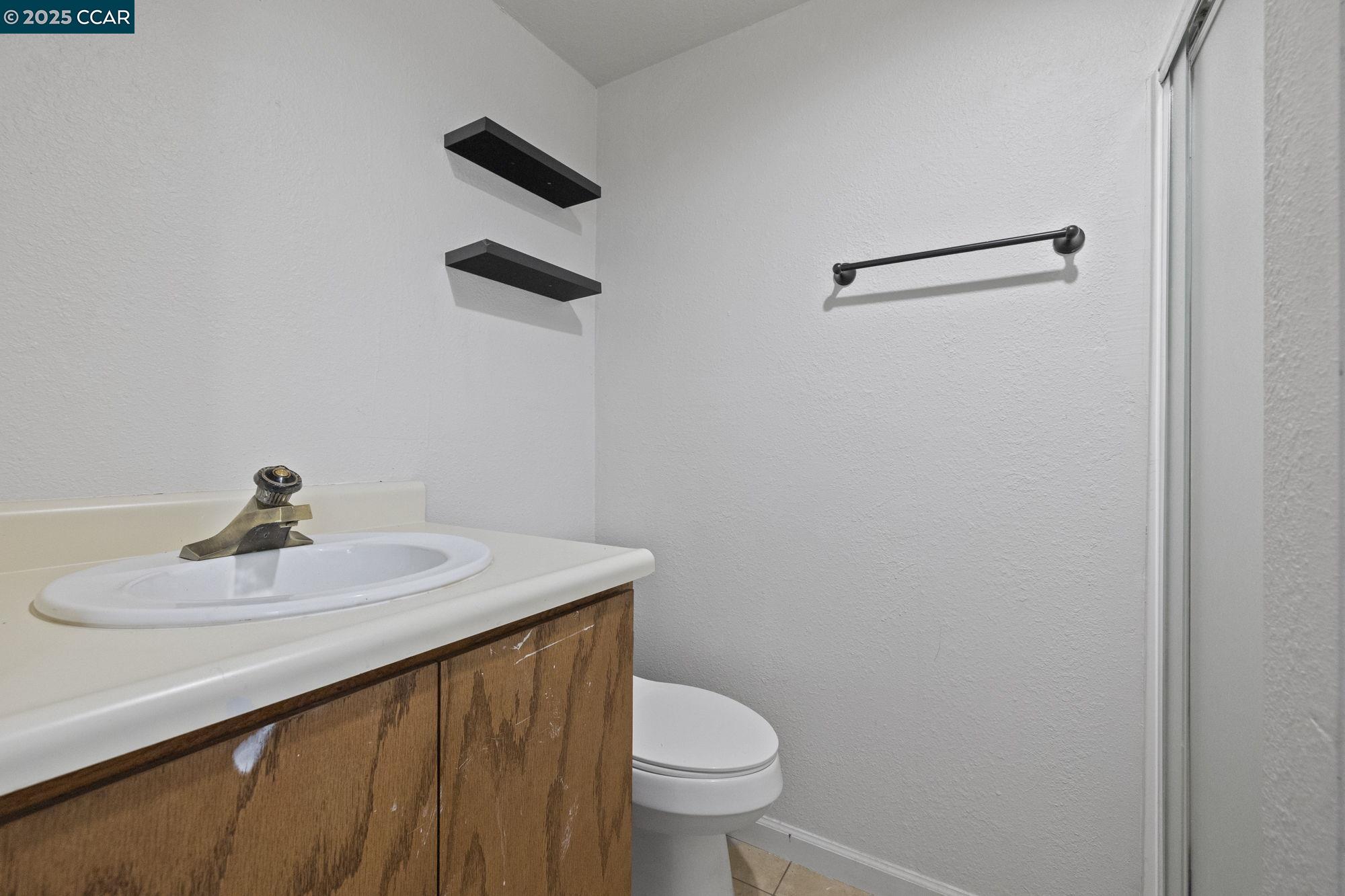 18957 Stag Circle Tuolumne, CA 95379 - Photo 11 of 22 a bathroom with a sink toilet and a mirror