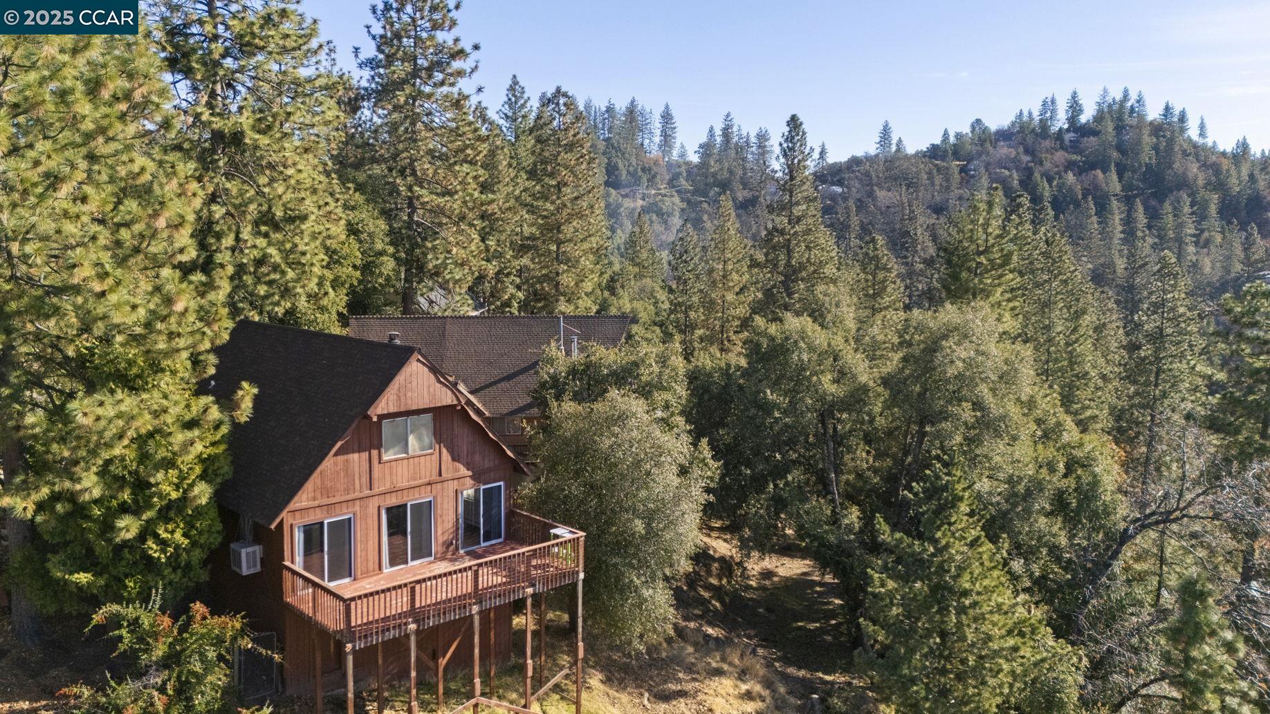 18957 Stag Circle Tuolumne, CA 95379 - Photo 16 of 22 a view of a house with a yard and a trees