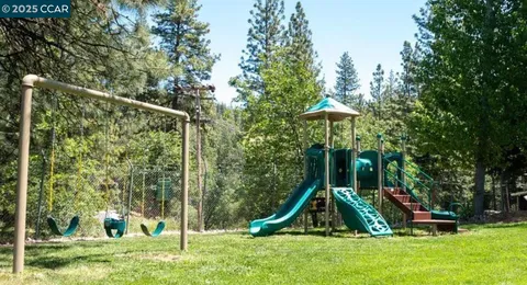 a view of a park with a slide